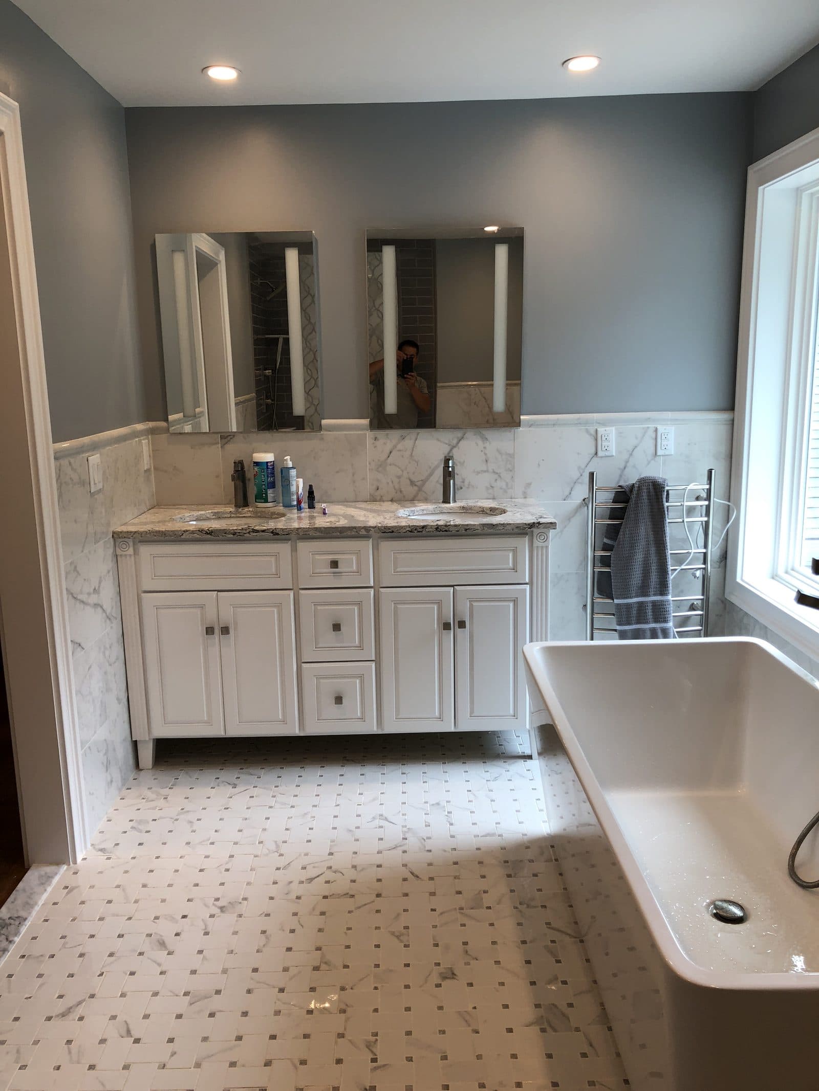 Tiled bathroom with white vanity