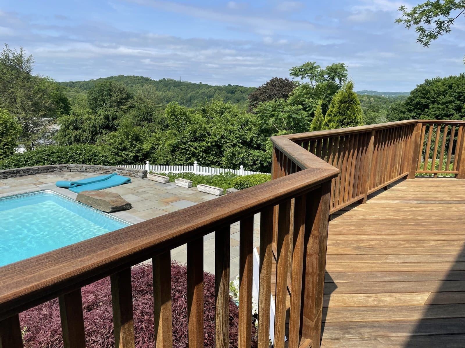Deck overlooking pool and landscape