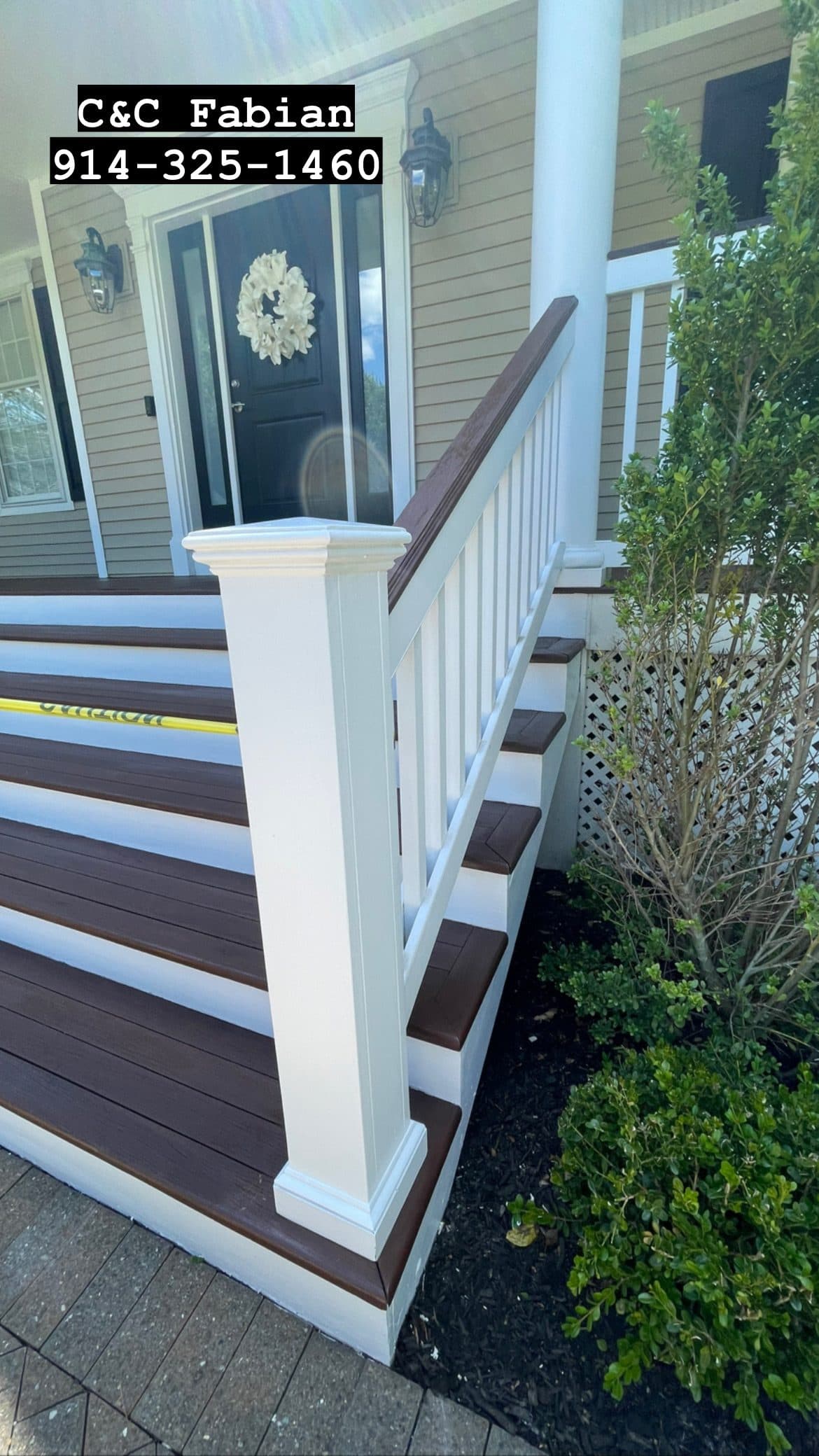 White deck railing and posts on house