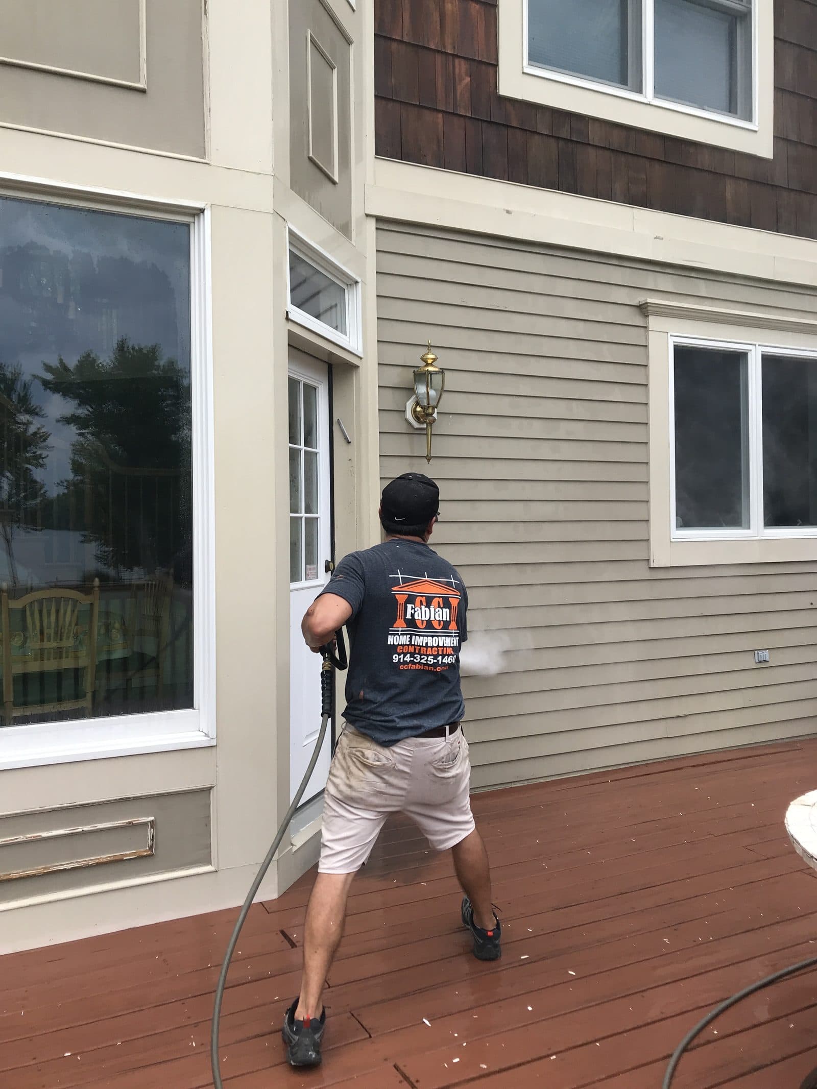 Worker installing composite deck boards