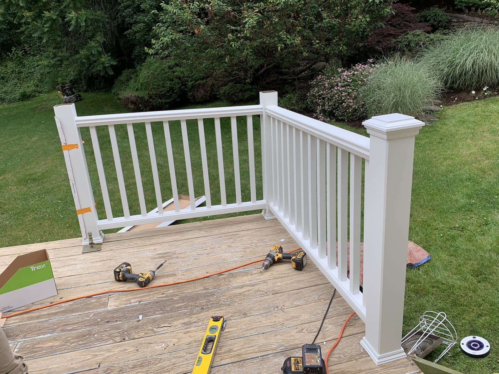 White railing deck on wood surface