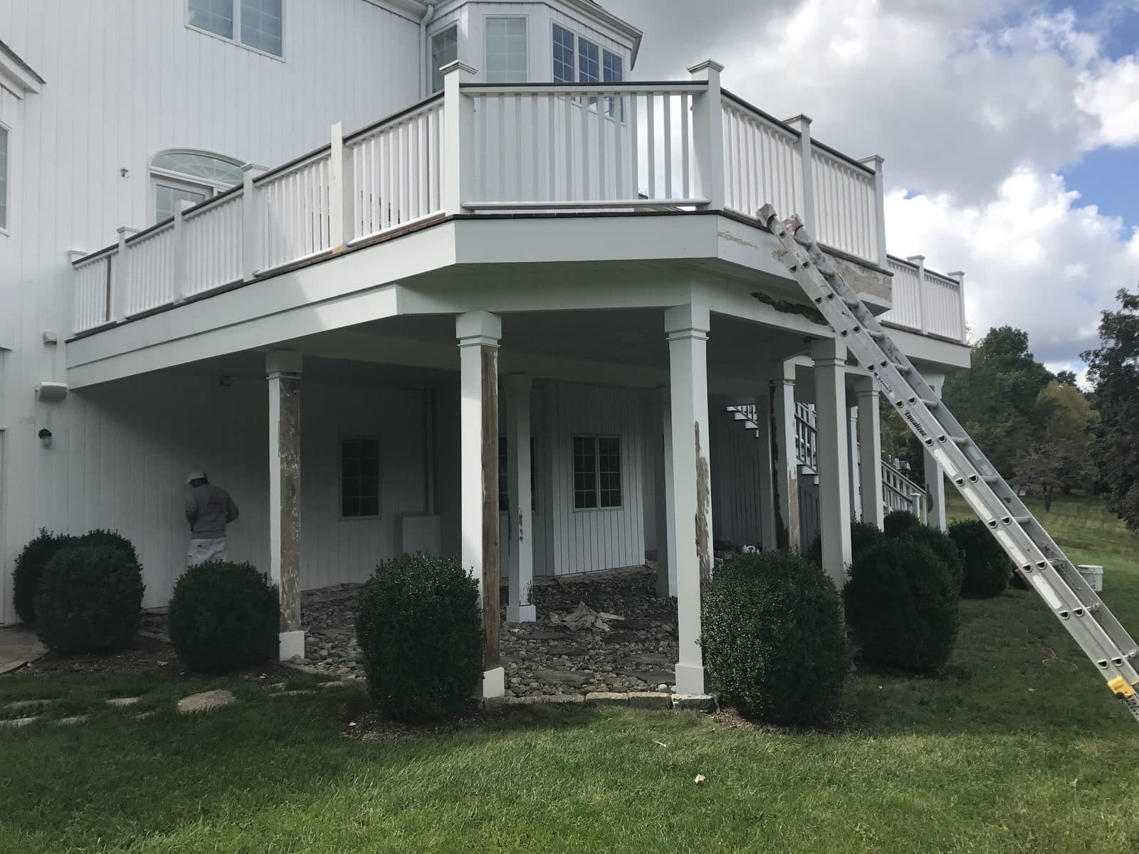 White house with columns and porch