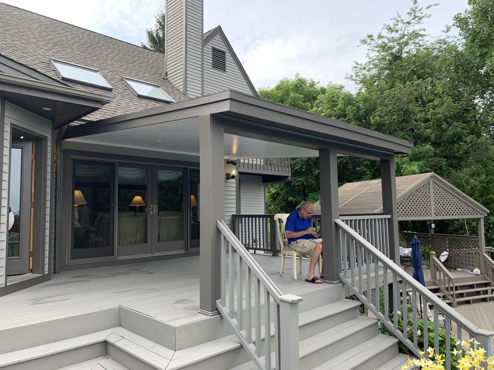 Gray house with covered porch and steps