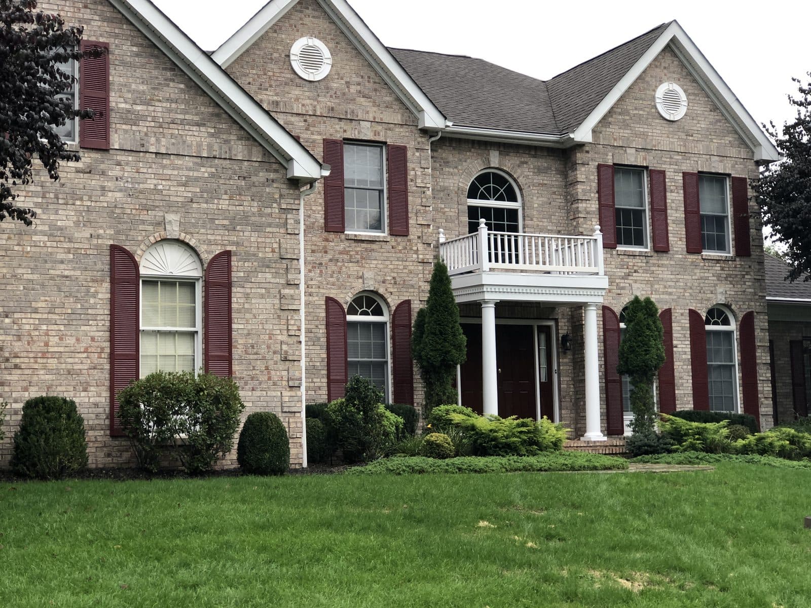 Large brick colonial home exterior