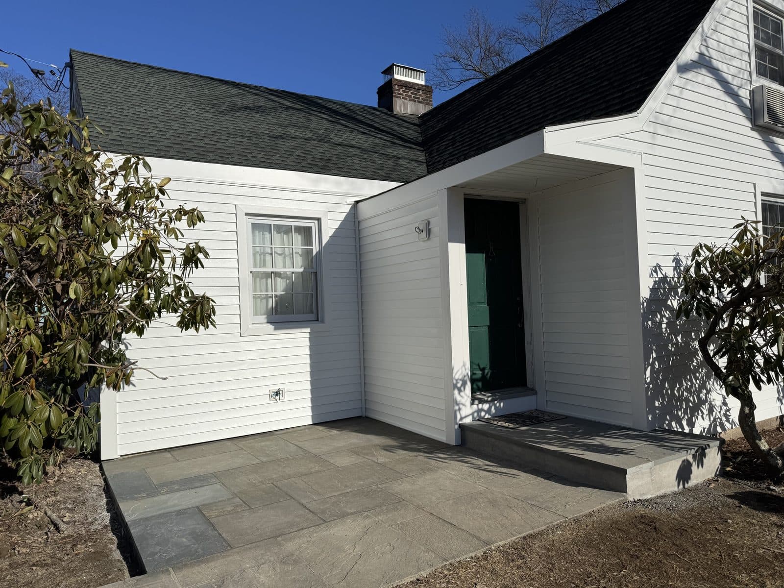 White house exterior with landscaping