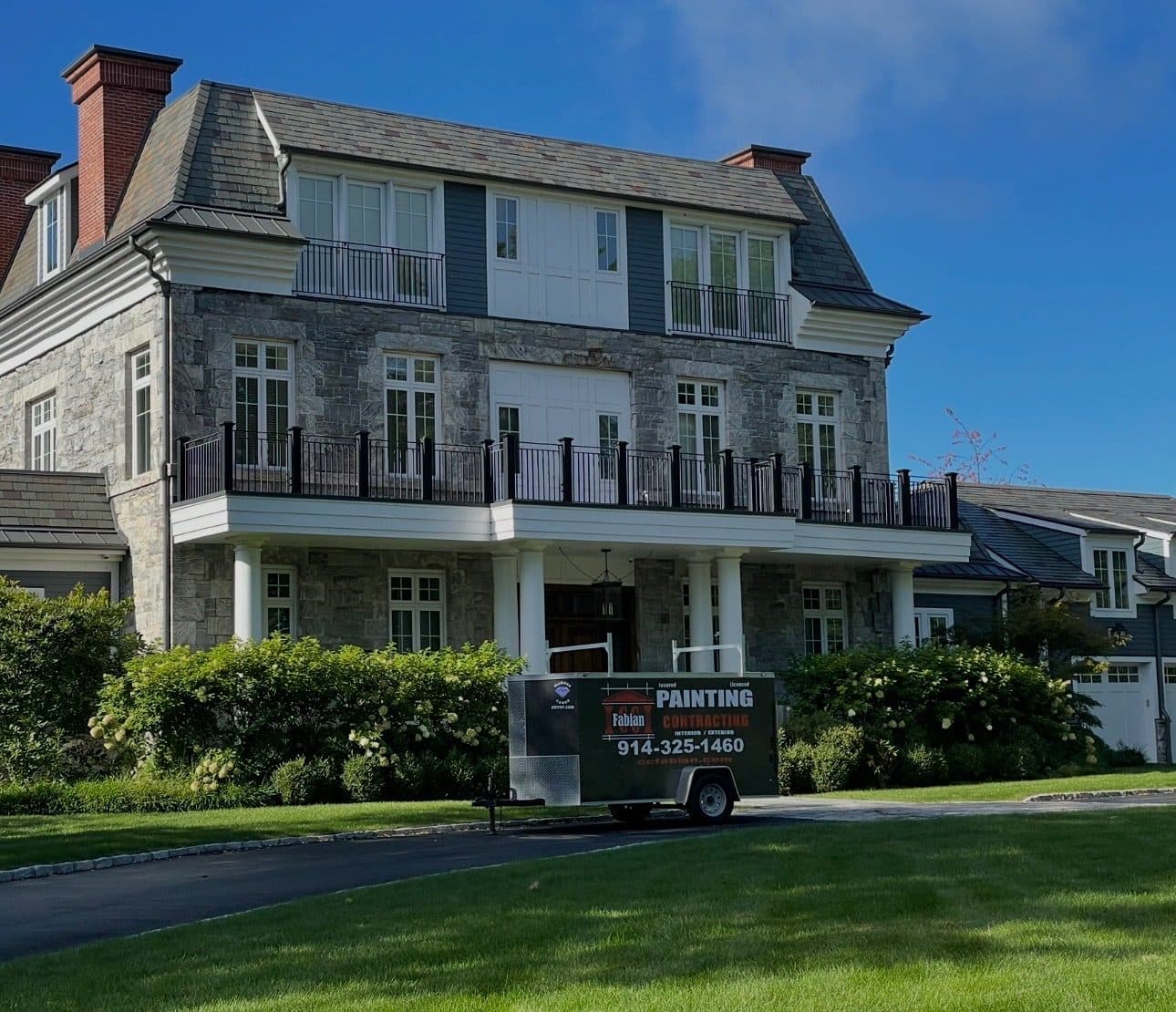 Large home exterior with balcony