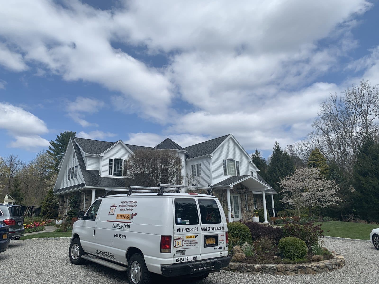 The C&C Fabian work van outside a classic Westchester colonial home.