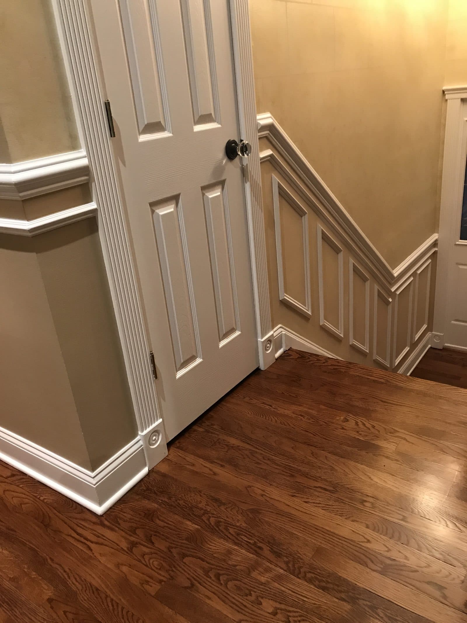 Hardwood flooring with white baseboards