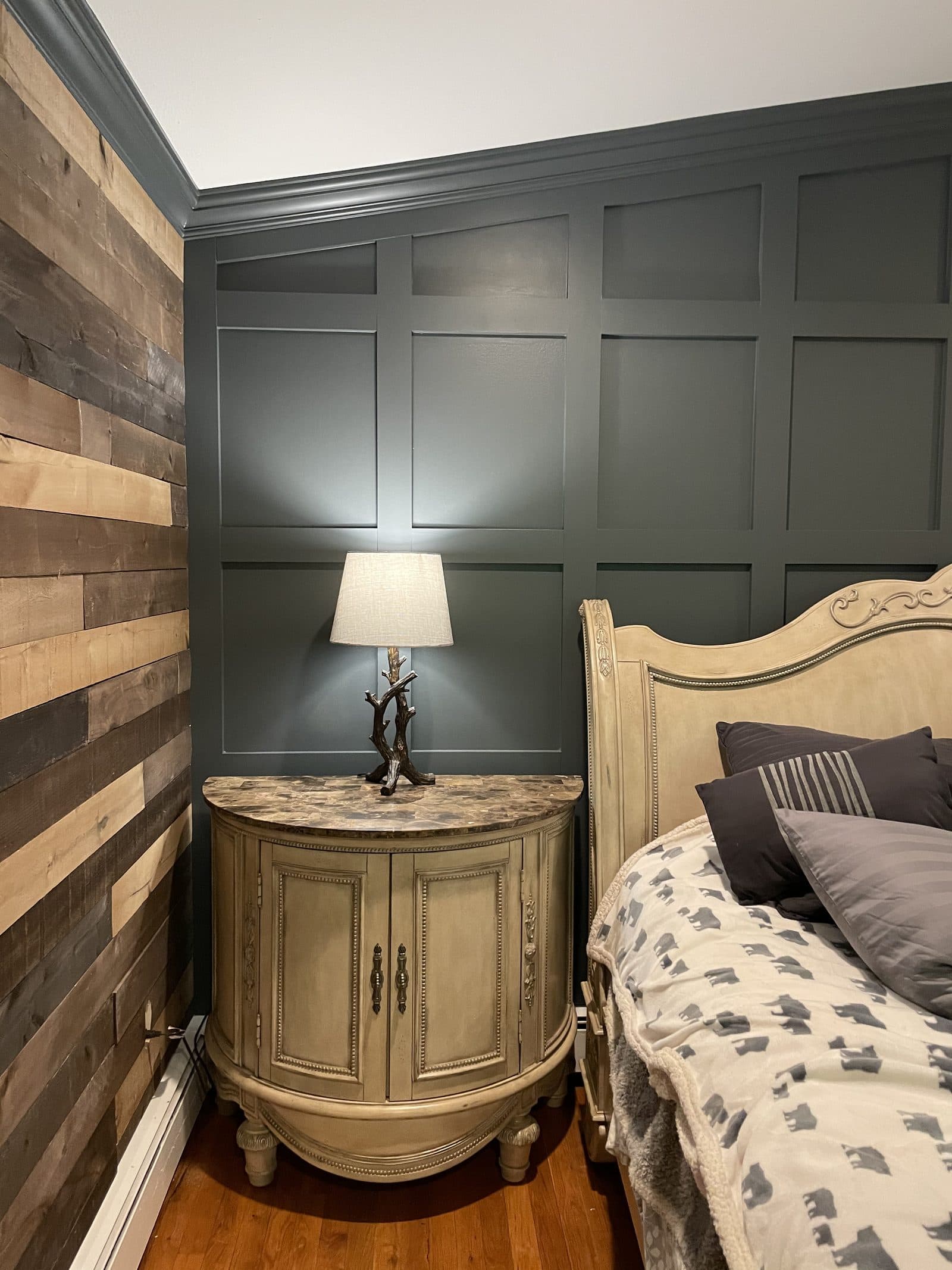 Bedroom with paneled wall