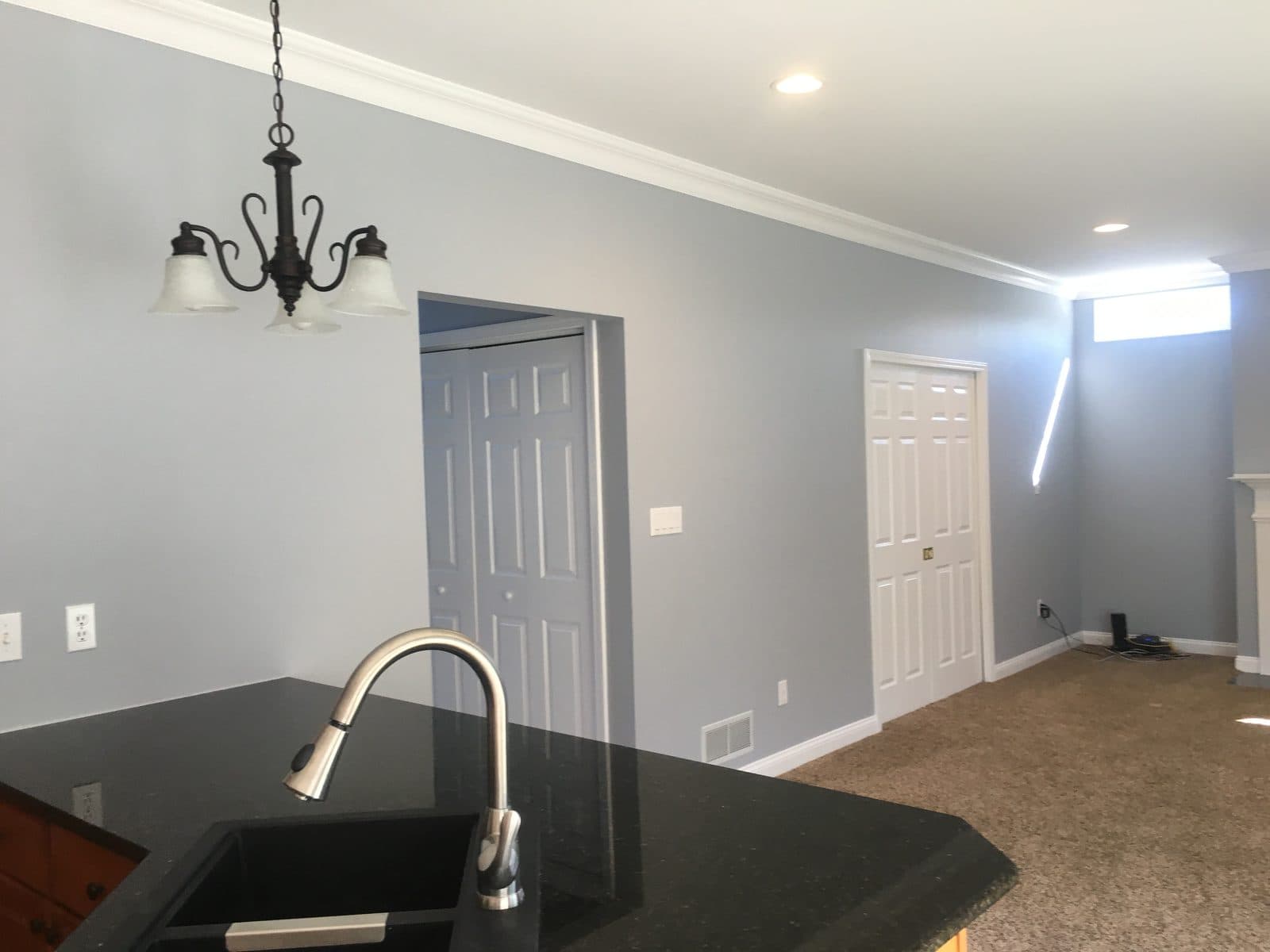 Kitchen with island and dark countertop