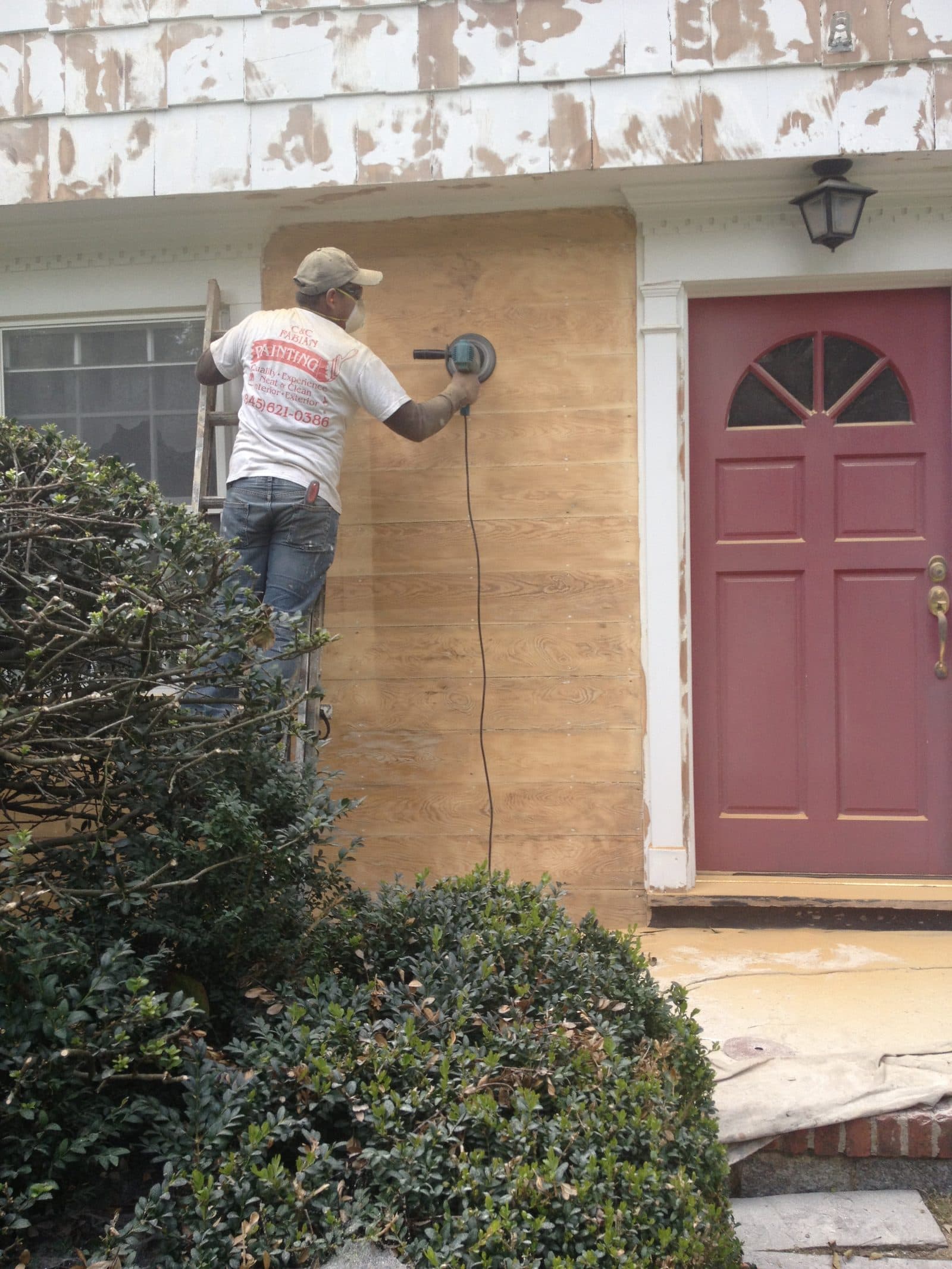 Stone exterior with red shutters