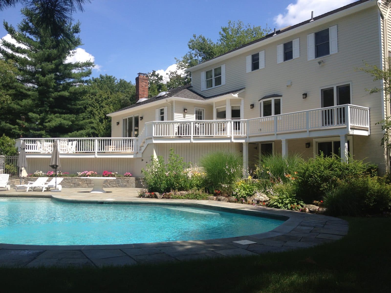 House with pool and stone patio
