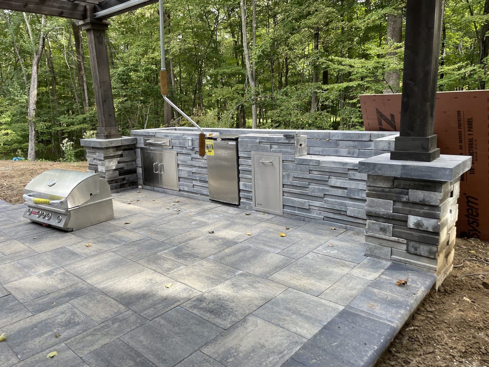 Stone paver patio with seating wall