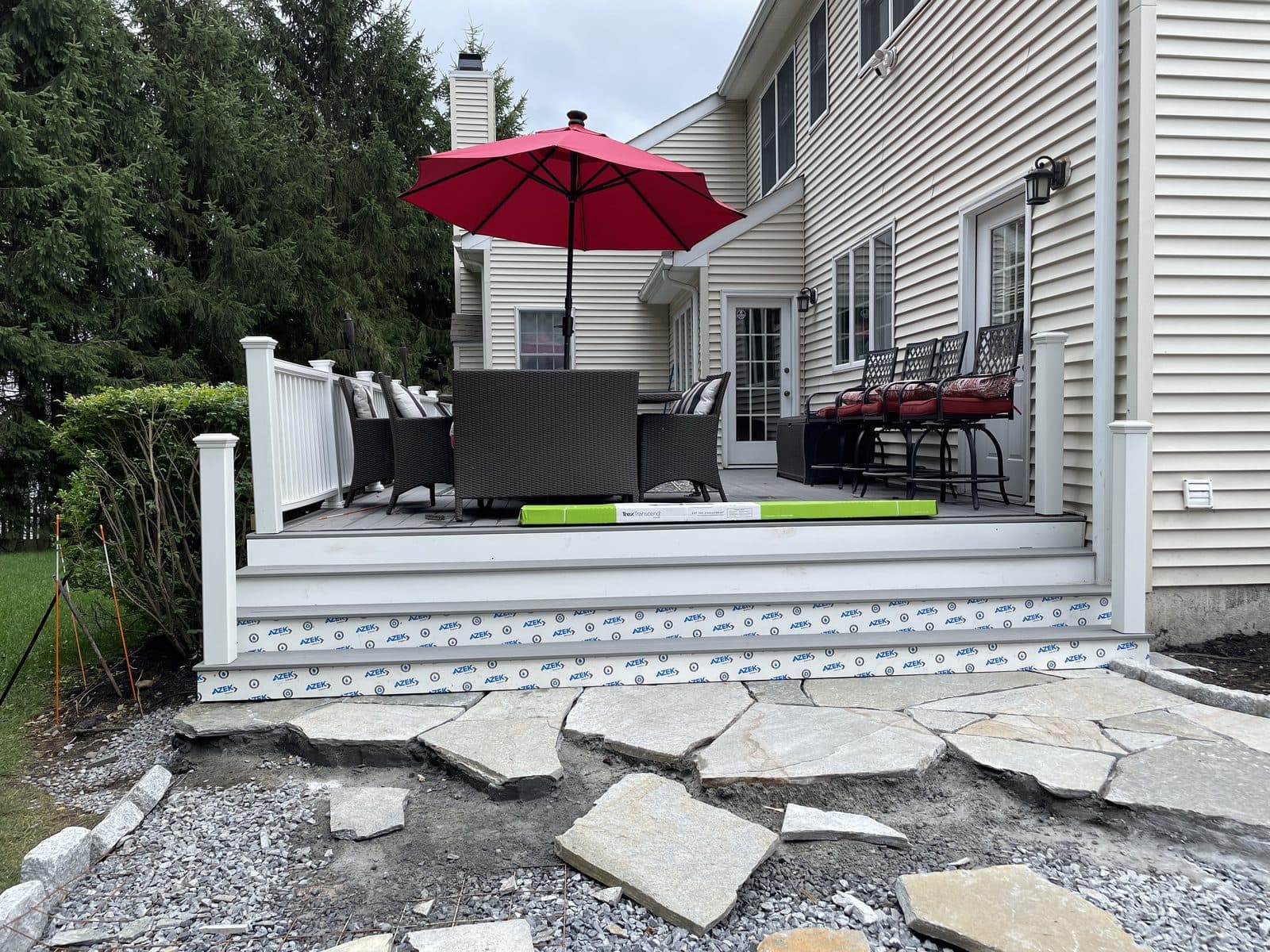 Backyard patio with umbrella and pavers