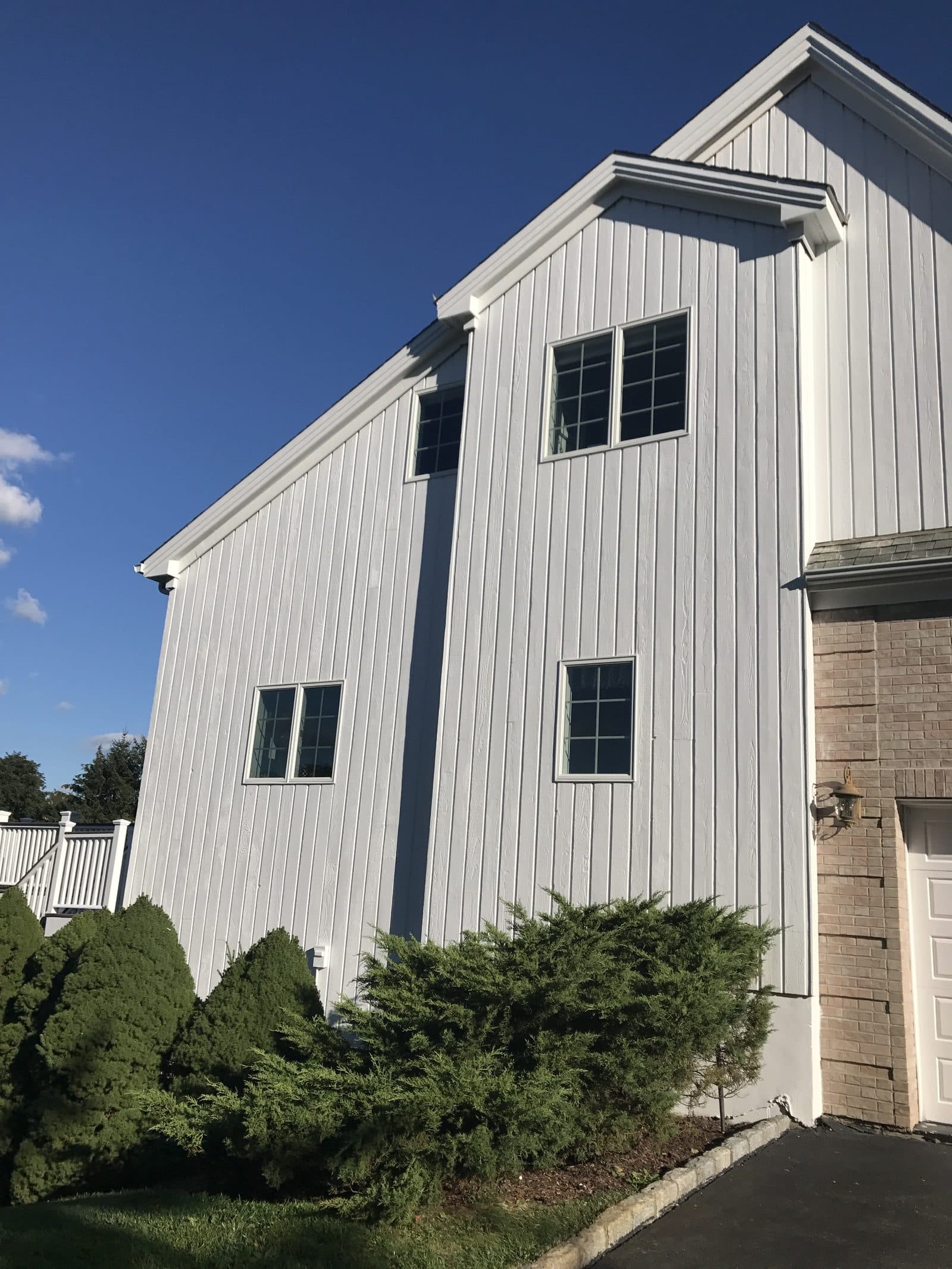 Gray house roof and siding aerial view