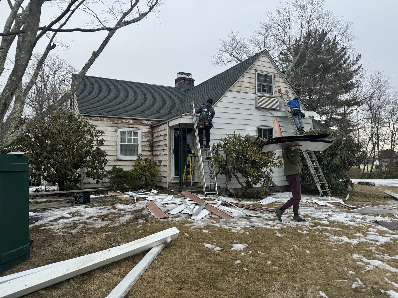 C&C Fabian crew working at a home during winter conditions.