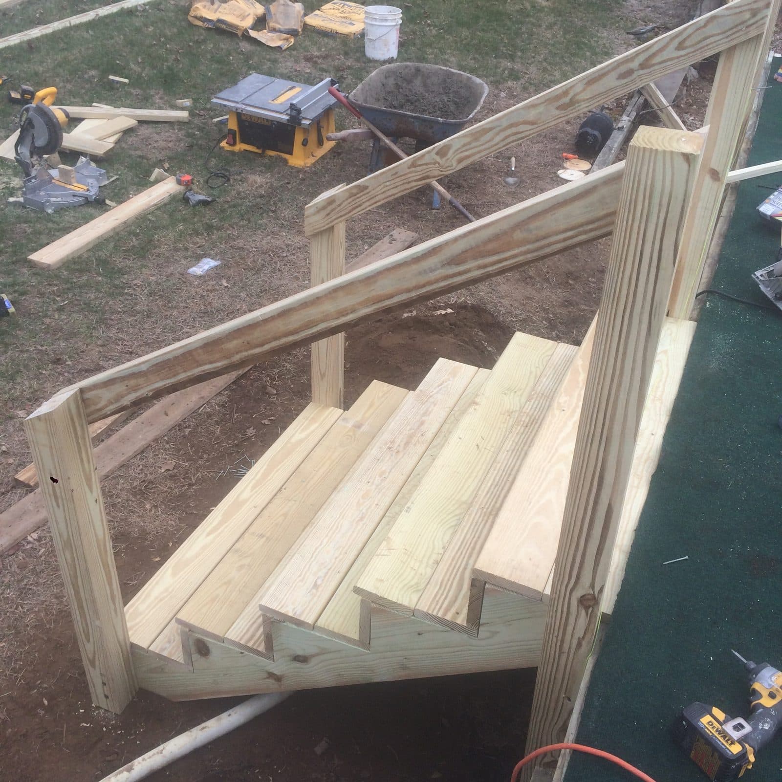 New wood staircase stringers and treads under construction