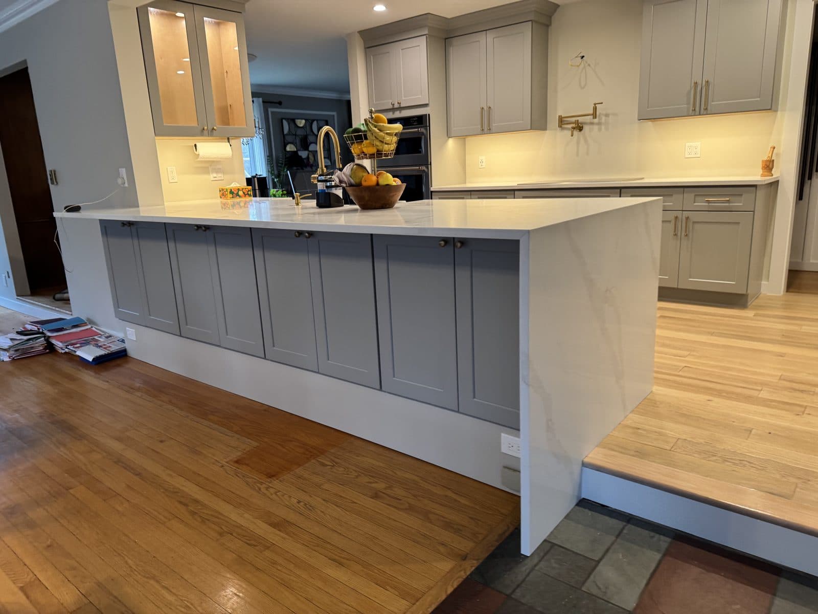 Finished kitchen with custom cabinetry and a marble island