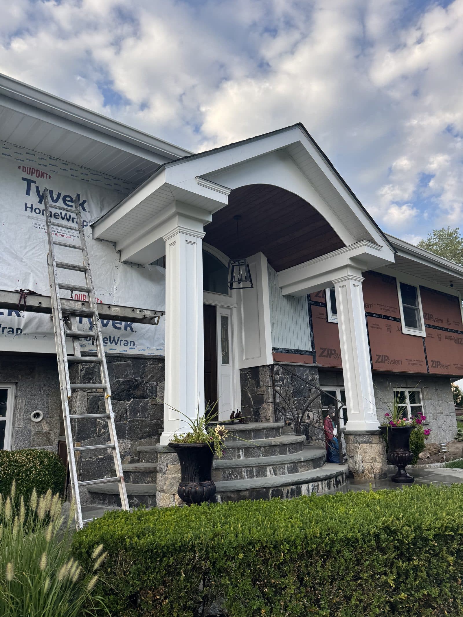 Completed home with a custom columned portico and trim