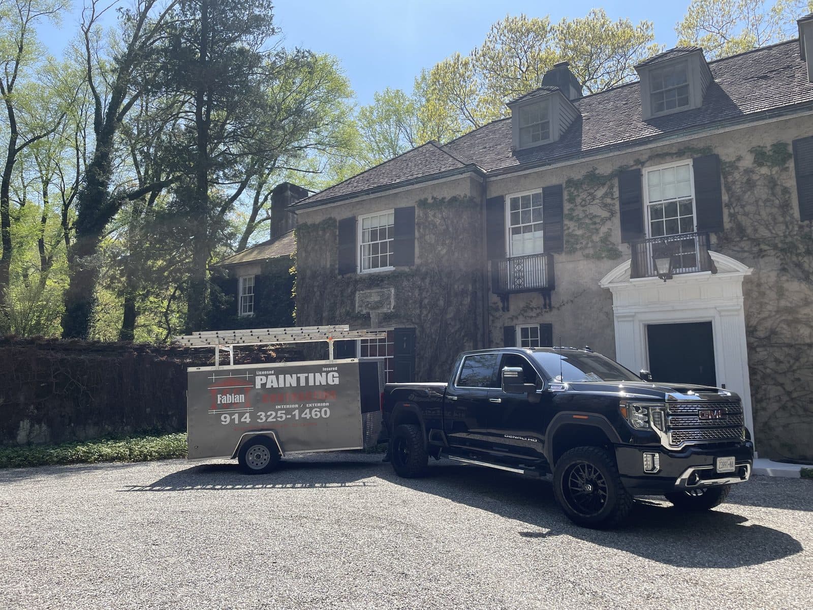 C&C Fabian truck and hauling trailer at a job site