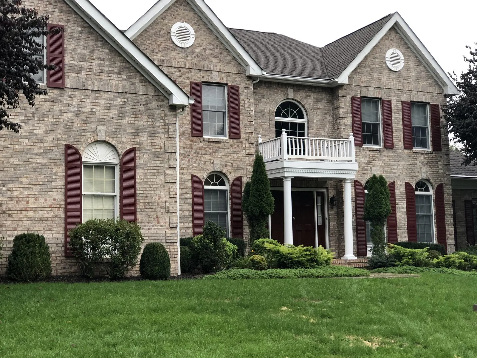 Large brick colonial home exterior