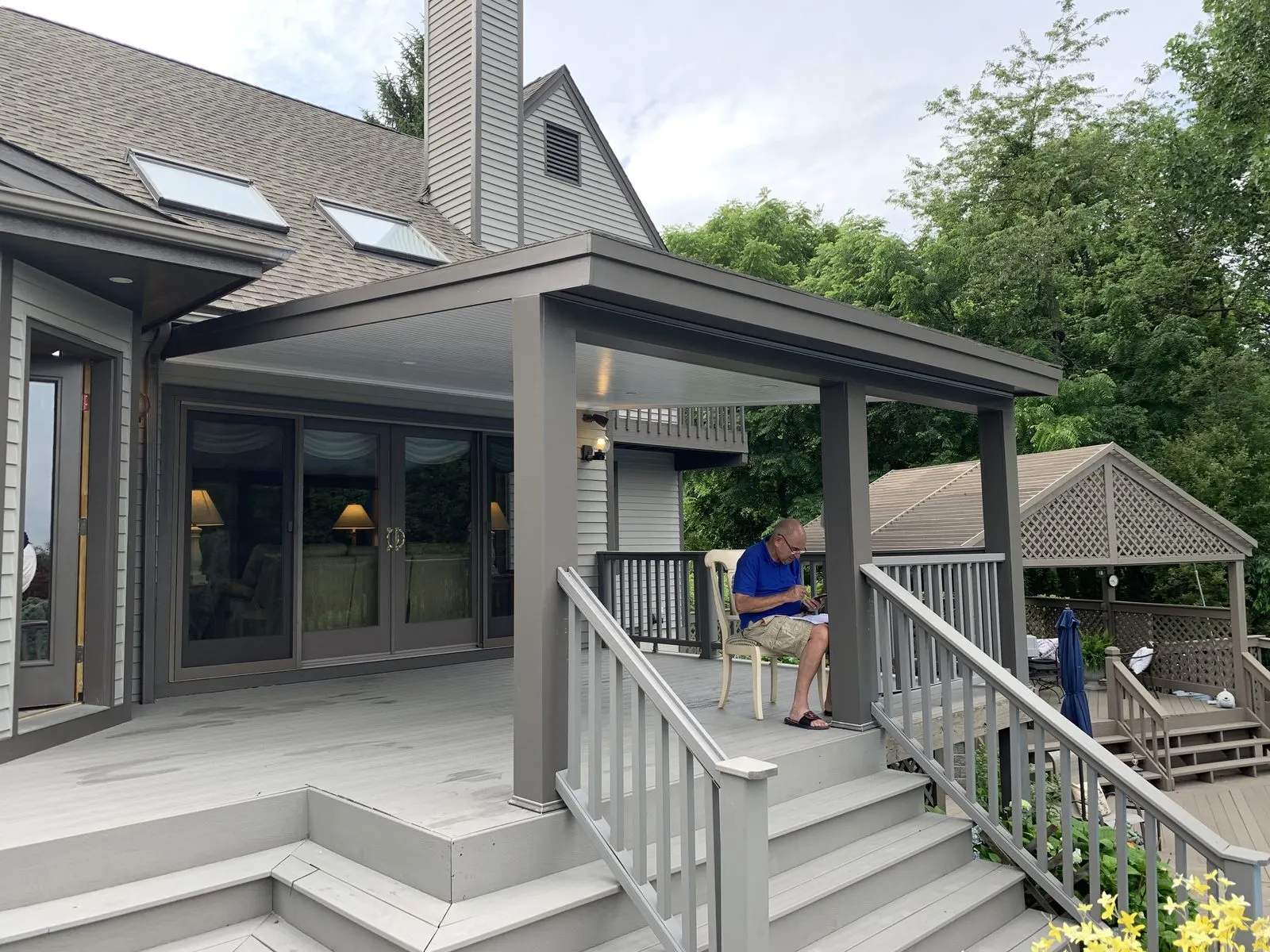 Gray house with covered porch and steps