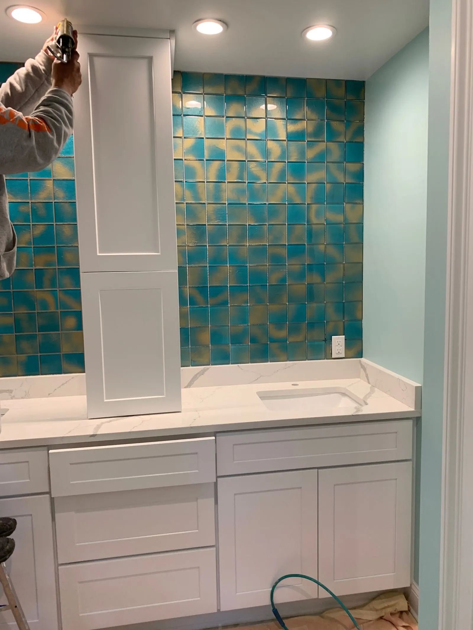 Installing new wall tile during a bathroom remodel