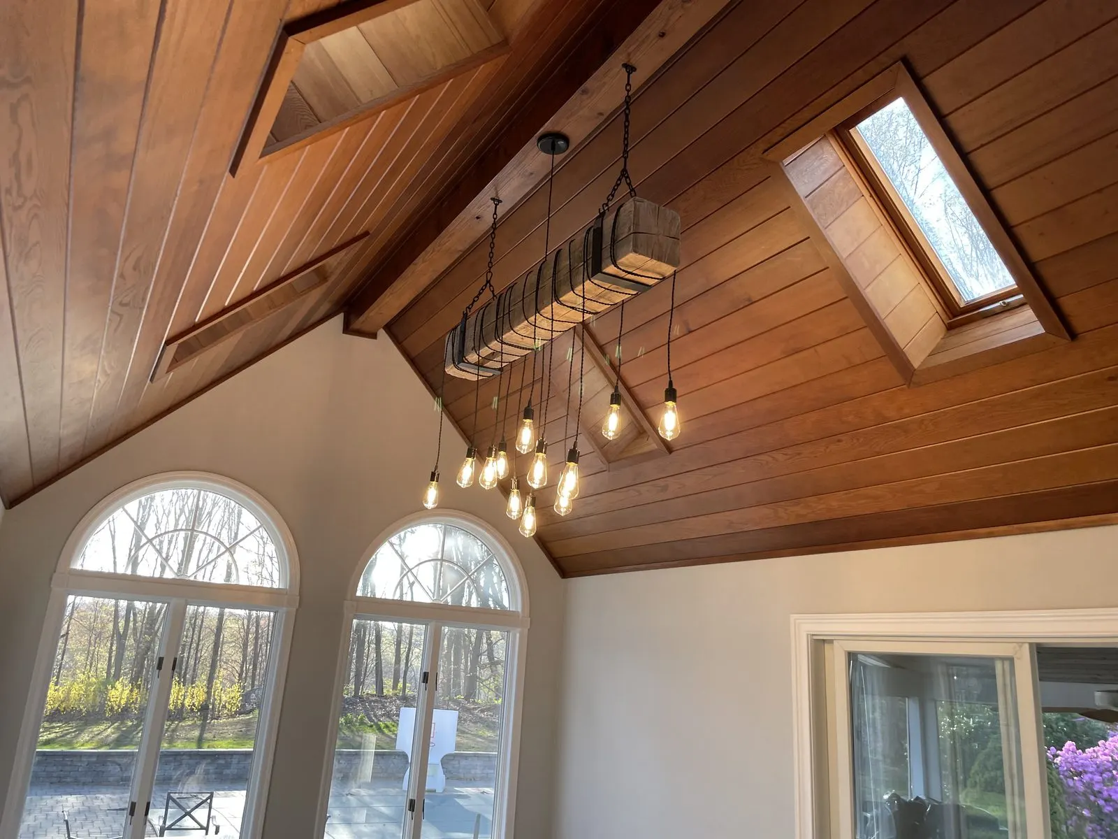 Cathedral wood ceiling with arched windows