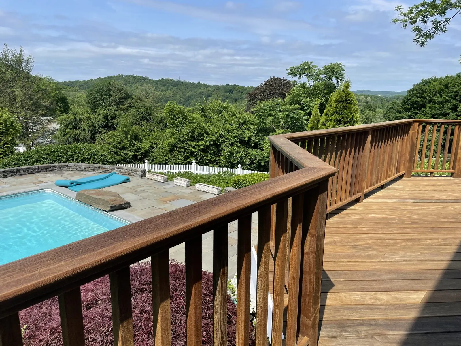 Deck overlooking pool and landscape
