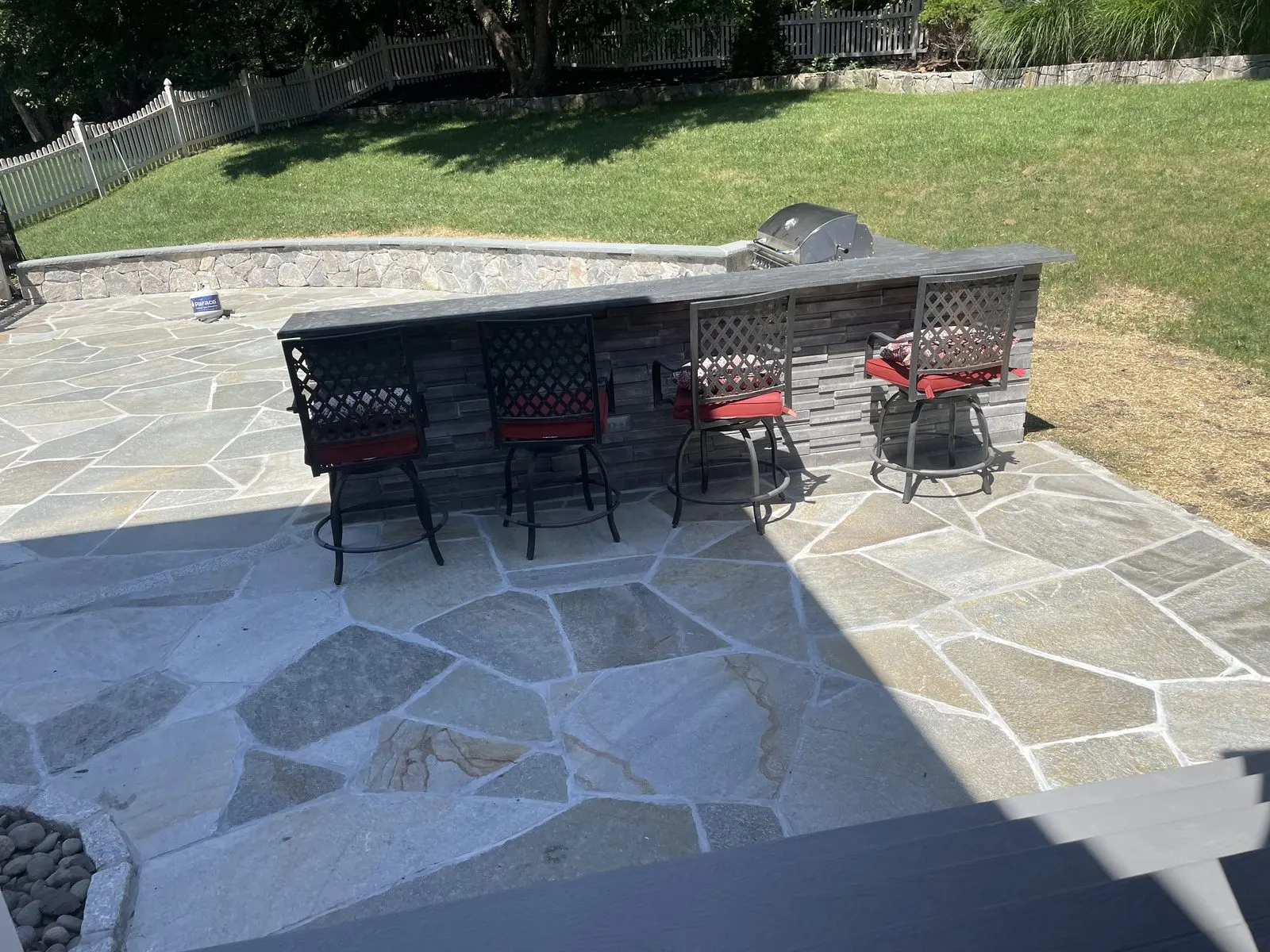 Flagstone patio with built-in bar and seating