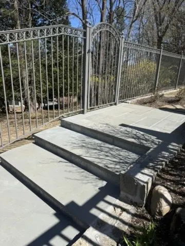 White ornamental double gate and fence