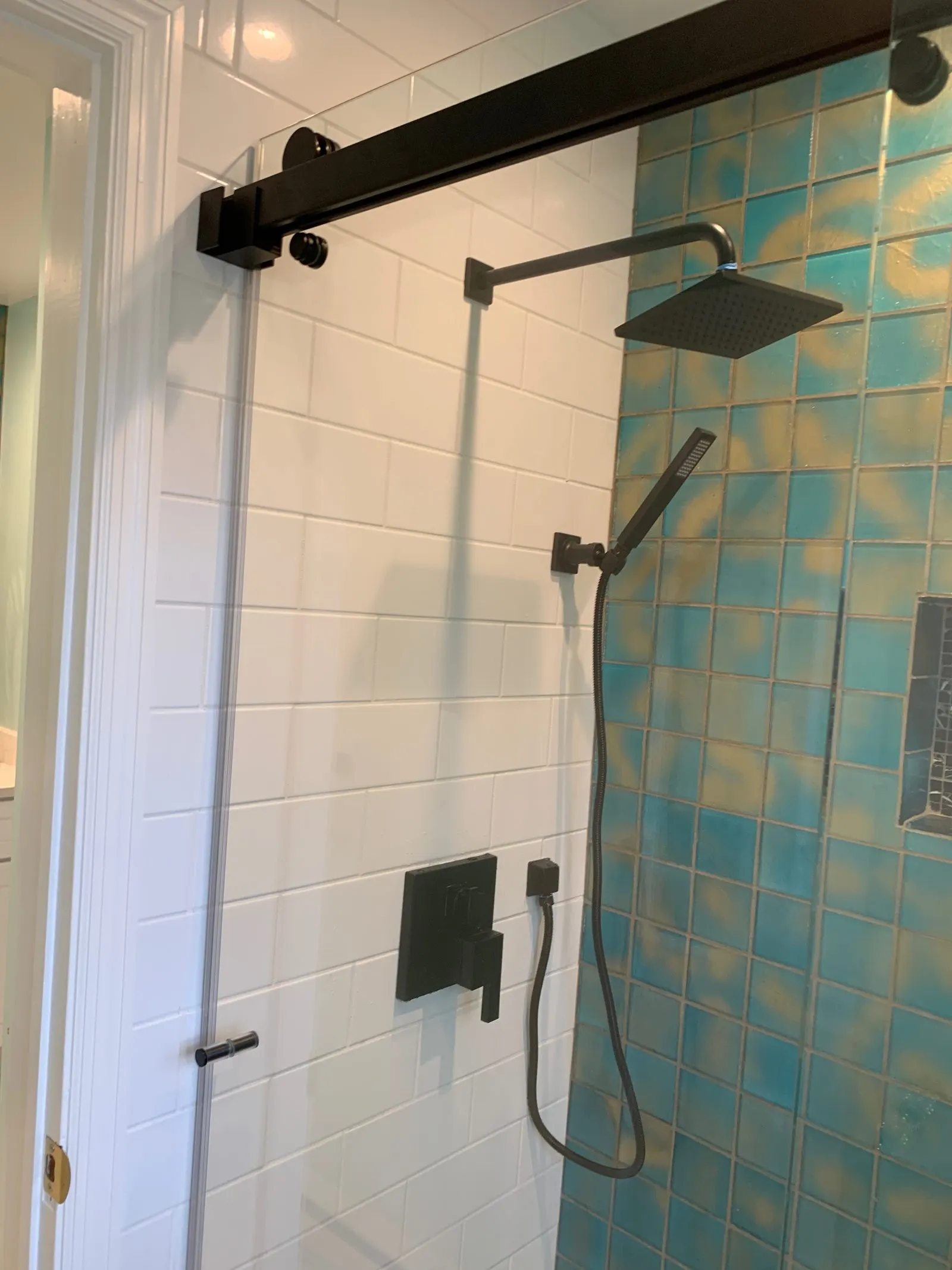 Finished tiled shower with matte-black fixtures