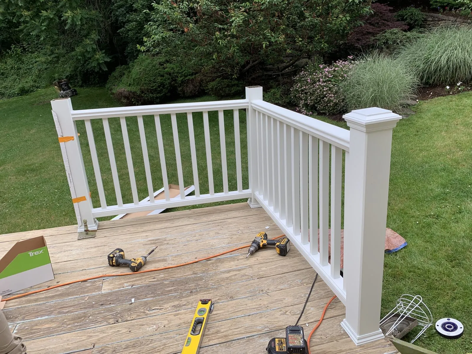 White railing deck on wood surface