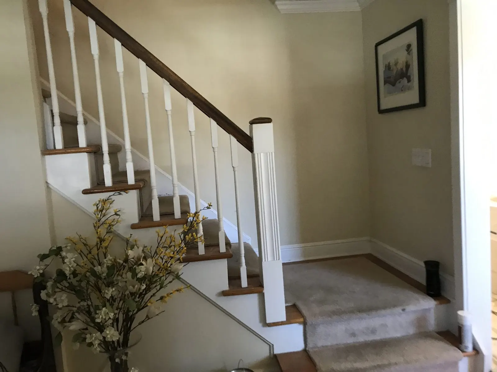 Staircase with white trim entryway