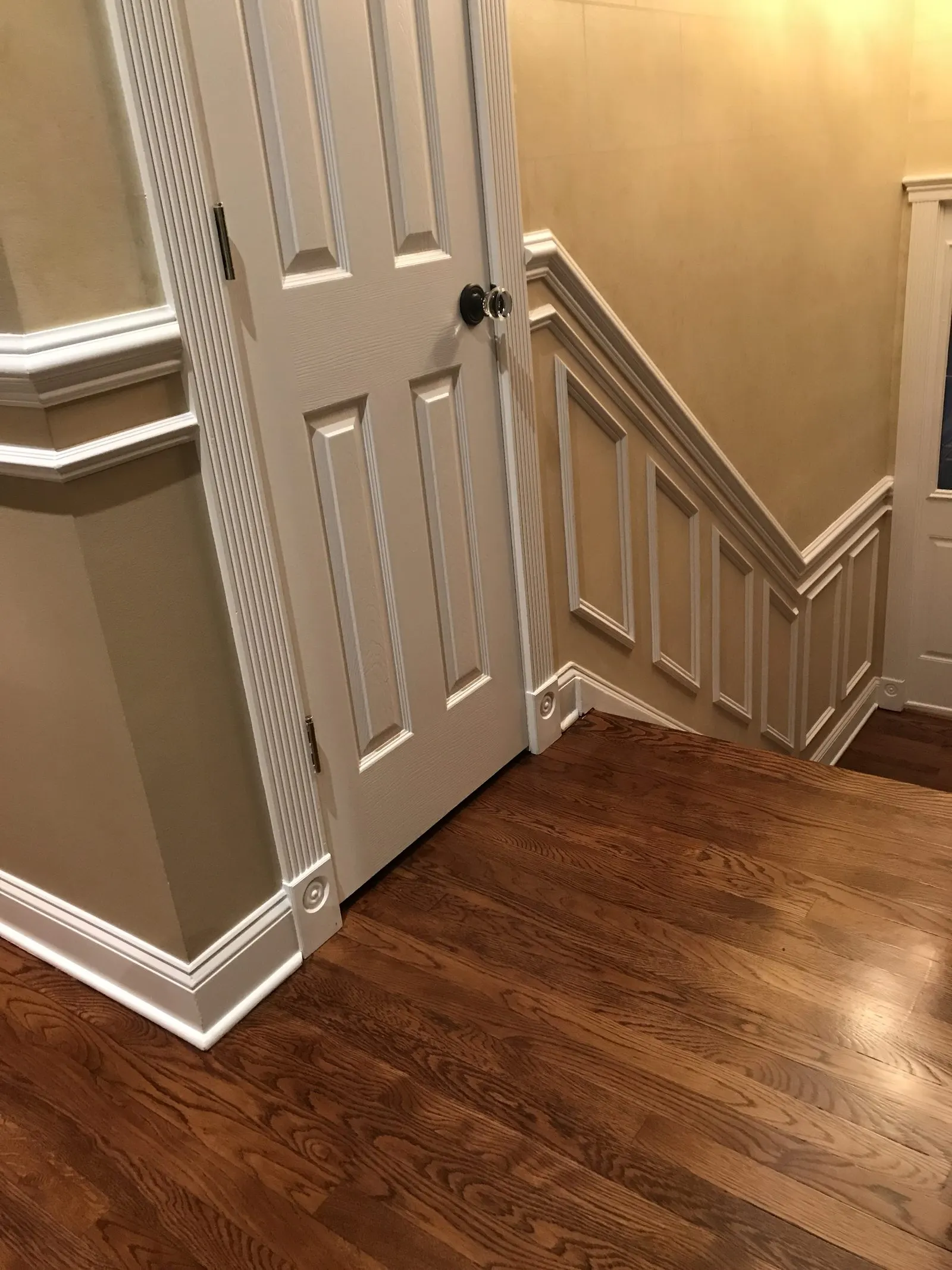 Hardwood flooring with white baseboards