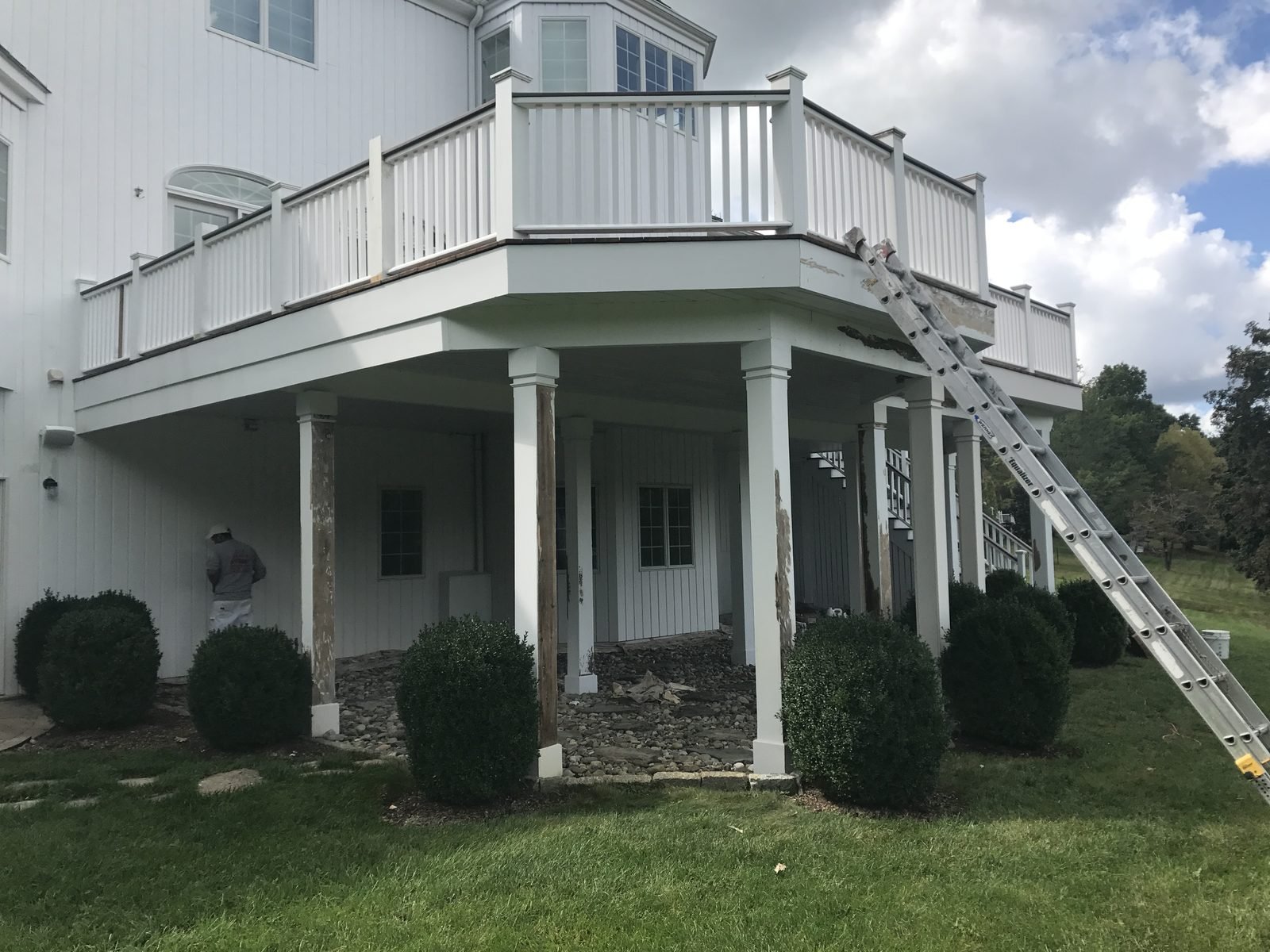 White house with columns and porch