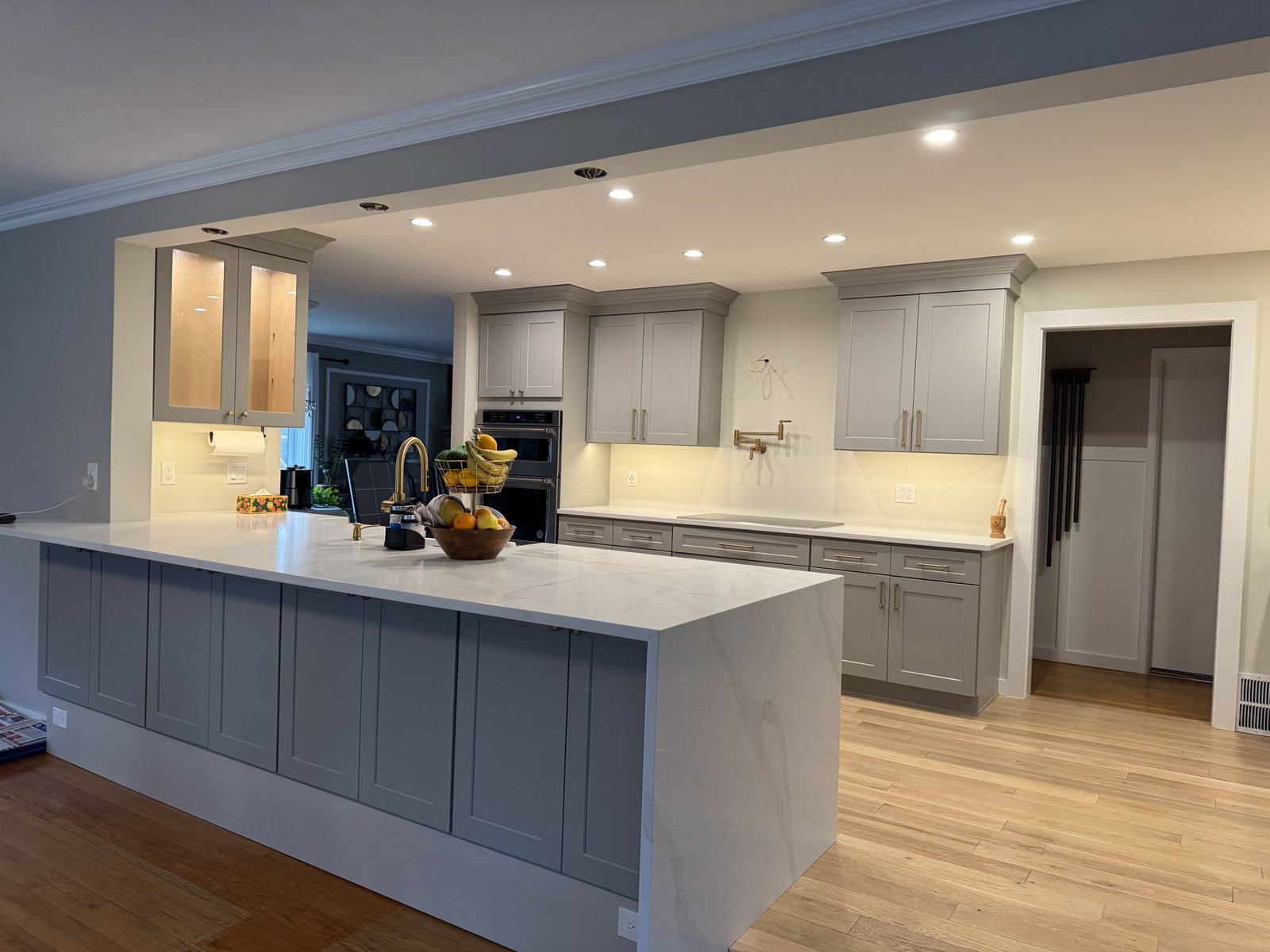 Remodeled kitchen with a large island and built-in double wall oven