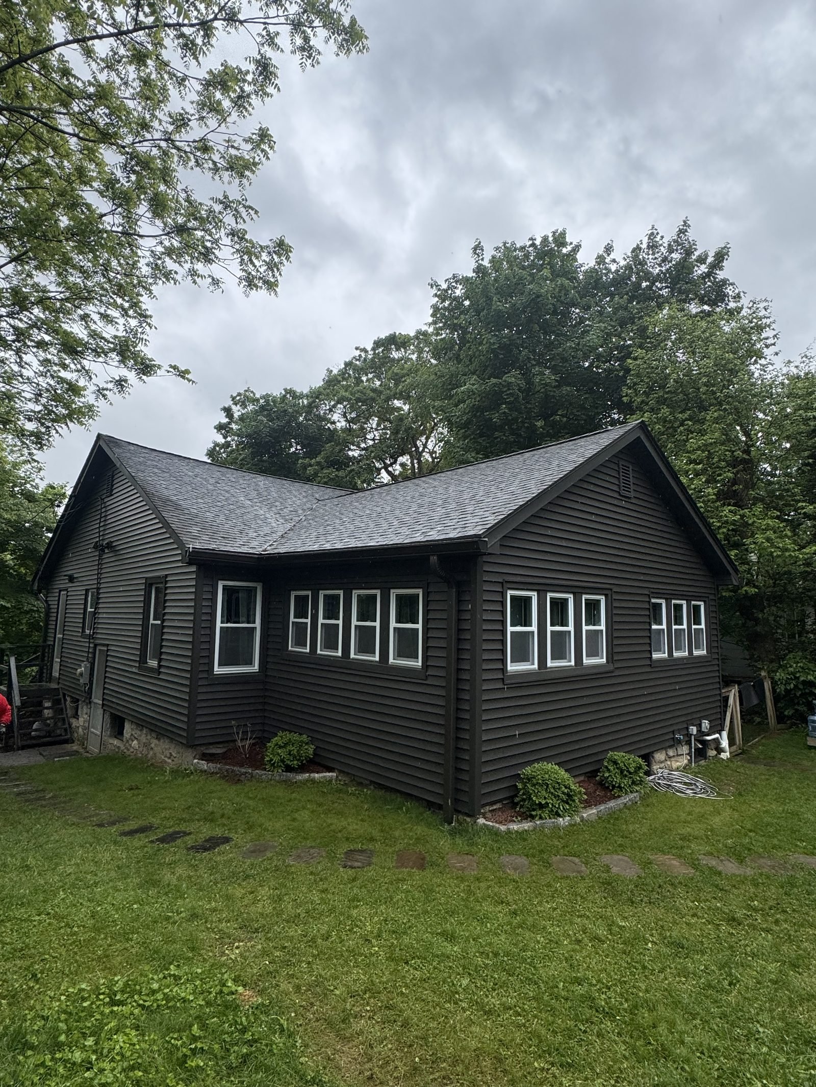 Dark-sided home with crisp white window trim